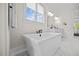 Soaking tub is complemented by a large window and marble floors, with bright natural light at 111 Stone Park Dr, Wake Forest, NC 27587