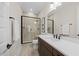 Modern bathroom featuring a glass-enclosed shower, tiled floors, and a vanity with a vessel sink at 111 Stone Park Dr, Wake Forest, NC 27587