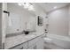Stylish bathroom boasts granite countertops, double sinks, and a soaking tub with tiled surround at 111 Stone Park Dr, Wake Forest, NC 27587