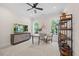 Bedroom featuring a desk, ceiling fan, a TV console, and two windows that provide natural light at 111 Stone Park Dr, Wake Forest, NC 27587