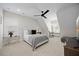Bright bedroom featuring a tufted headboard, plush bedding, and natural light at 111 Stone Park Dr, Wake Forest, NC 27587