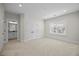 Spacious bedroom with carpet, natural light, closet and access to bathroom at 111 Stone Park Dr, Wake Forest, NC 27587