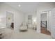 Sitting area in the bedroom, providing a cozy retreat near the staircase and bathroom at 111 Stone Park Dr, Wake Forest, NC 27587