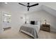 Bright bedroom featuring a tufted headboard, plush bedding, and natural light at 111 Stone Park Dr, Wake Forest, NC 27587