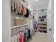 Well-organized walk-in closet with shelving, hanging rods, and ample space for clothing and accessories at 111 Stone Park Dr, Wake Forest, NC 27587