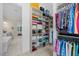 Organized walk-in closet featuring built-in shelving and rods for ample storage at 111 Stone Park Dr, Wake Forest, NC 27587
