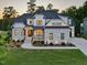 Beautiful stone and siding home with manicured landscaping and inviting front porch at 111 Stone Park Dr, Wake Forest, NC 27587