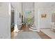 Open and bright foyer featuring hardwood floors, staircase, and high ceilings at 111 Stone Park Dr, Wake Forest, NC 27587