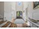 Inviting foyer with hardwood floors, stairs, high ceilings, and front door view at 111 Stone Park Dr, Wake Forest, NC 27587