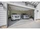 Spacious two car garage interior showing 2 late model SUVs at 111 Stone Park Dr, Wake Forest, NC 27587