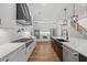 Beautiful kitchen featuring white cabinets, stainless steel appliances, and an expansive island at 111 Stone Park Dr, Wake Forest, NC 27587