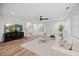 Bright living room with a TV, hardwood floors and stylish decor at 111 Stone Park Dr, Wake Forest, NC 27587