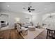Inviting living room with modern furnishings, hardwood floors, and access to other rooms at 111 Stone Park Dr, Wake Forest, NC 27587