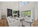 Spacious living room featuring a fireplace, built-ins, and access to outdoor spaces at 111 Stone Park Dr, Wake Forest, NC 27587