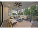 Cozy screened porch with comfortable seating and views of the surrounding landscape at 111 Stone Park Dr, Wake Forest, NC 27587