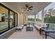Relaxing screened porch with views of the neighborhood, perfect for outdoor enjoyment at 111 Stone Park Dr, Wake Forest, NC 27587