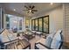 Elegant screened porch with stylish furniture, offering a serene retreat at 111 Stone Park Dr, Wake Forest, NC 27587