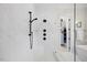 Walk-in shower with multiple shower heads, bench and stylish tile, adding luxury to the bathroom at 111 Stone Park Dr, Wake Forest, NC 27587