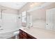 Bathroom featuring a combined shower and tub, a single sink vanity with a large mirror at 120 Ryder Cup Cir, Raleigh, NC 27603