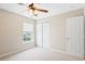 Cozy bedroom featuring carpet, a window for natural light, and closet at 120 Ryder Cup Cir, Raleigh, NC 27603