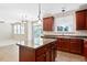 Spacious kitchen featuring a center island, ample counter space, and modern fixtures at 120 Ryder Cup Cir, Raleigh, NC 27603