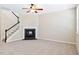 Cozy living room featuring a fireplace, staircase, neutral paint, and plush carpeting at 120 Ryder Cup Cir, Raleigh, NC 27603
