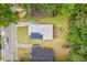 This is an aerial view showing the house has a back deck and solar panels at 1207 Grant St, Durham, NC 27701