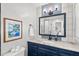 Bathroom featuring an updated vanity, granite countertop, and updated finishes at 1207 Grant St, Durham, NC 27701