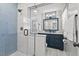 Bathroom featuring blue and white patterned tiles in shower and as backsplash at 1207 Grant St, Durham, NC 27701