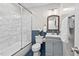 Updated bathroom with a stylish vanity, and shower and bathtub at 1207 Grant St, Durham, NC 27701