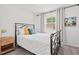 Cozy bedroom with natural light and neutral paint, showcasing comfort at 1207 Grant St, Durham, NC 27701