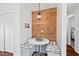 Cozy breakfast nook with cushioned seating, wood-paneled accent wall, and pendant lighting at 1207 Grant St, Durham, NC 27701