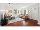 Bright living room featuring hardwood floors and ample natural light at 1207 Grant St, Durham, NC 27701