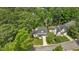 Aerial view of a beautifully landscaped home nestled among lush trees at 12117 Inglehurst Dr, Raleigh, NC 27613