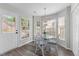 Cozy breakfast nook with lots of windows providing ample natural light and backyard views at 12117 Inglehurst Dr, Raleigh, NC 27613