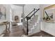 Elegant foyer with staircase leading to the second floor, seamlessly connecting to the living room at 12117 Inglehurst Dr, Raleigh, NC 27613