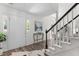 Inviting foyer featuring hardwood floors, staircase, and natural light at 12117 Inglehurst Dr, Raleigh, NC 27613