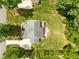 An aerial view of the property with lush lawn, a fire pit, and a hot tub in a private backyard at 12216 Kyle Abbey Ln, Raleigh, NC 27613