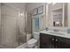Bathroom with a large walk-in shower, a black vanity, and neutral walls with accent tile at 12216 Kyle Abbey Ln, Raleigh, NC 27613