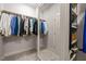 Walk-in closet with built-in shelving and rods for organization at 12216 Kyle Abbey Ln, Raleigh, NC 27613
