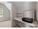 Spacious closet with built-in desk and shelving, window, and a carpeted floor at 12216 Kyle Abbey Ln, Raleigh, NC 27613
