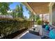 Relax on this covered porch with stylish furniture and enjoy serene views of the surrounding greenery at 12216 Kyle Abbey Ln, Raleigh, NC 27613