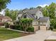 Charming two-story home with a well-manicured lawn, a three-car garage and beautiful stone accents at 12216 Kyle Abbey Ln, Raleigh, NC 27613