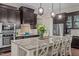 Gourmet kitchen with a large island, granite countertops, stainless steel appliances, and custom cabinetry at 12216 Kyle Abbey Ln, Raleigh, NC 27613