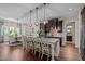 Spacious kitchen featuring a large island with seating, granite countertops, and stainless steel appliances at 12216 Kyle Abbey Ln, Raleigh, NC 27613