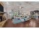 Bright living room featuring a coffered ceiling, hardwood floors, large windows, and an open layout at 12216 Kyle Abbey Ln, Raleigh, NC 27613