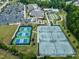 Aerial view of clubhouse, tennis courts, pickle ball, and parking lot at 123 Turnstone Dr, Durham, NC 27703