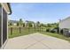 View of back patio with black fence and green space in a residential neighborhood at 123 Turnstone Dr, Durham, NC 27703