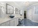 Beautiful bathroom with double vanities, blue tile flooring, and a walk-in closet at 123 Turnstone Dr, Durham, NC 27703