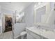 Bathroom with marble countertops, glass shower and walk-in closet in view at 123 Turnstone Dr, Durham, NC 27703